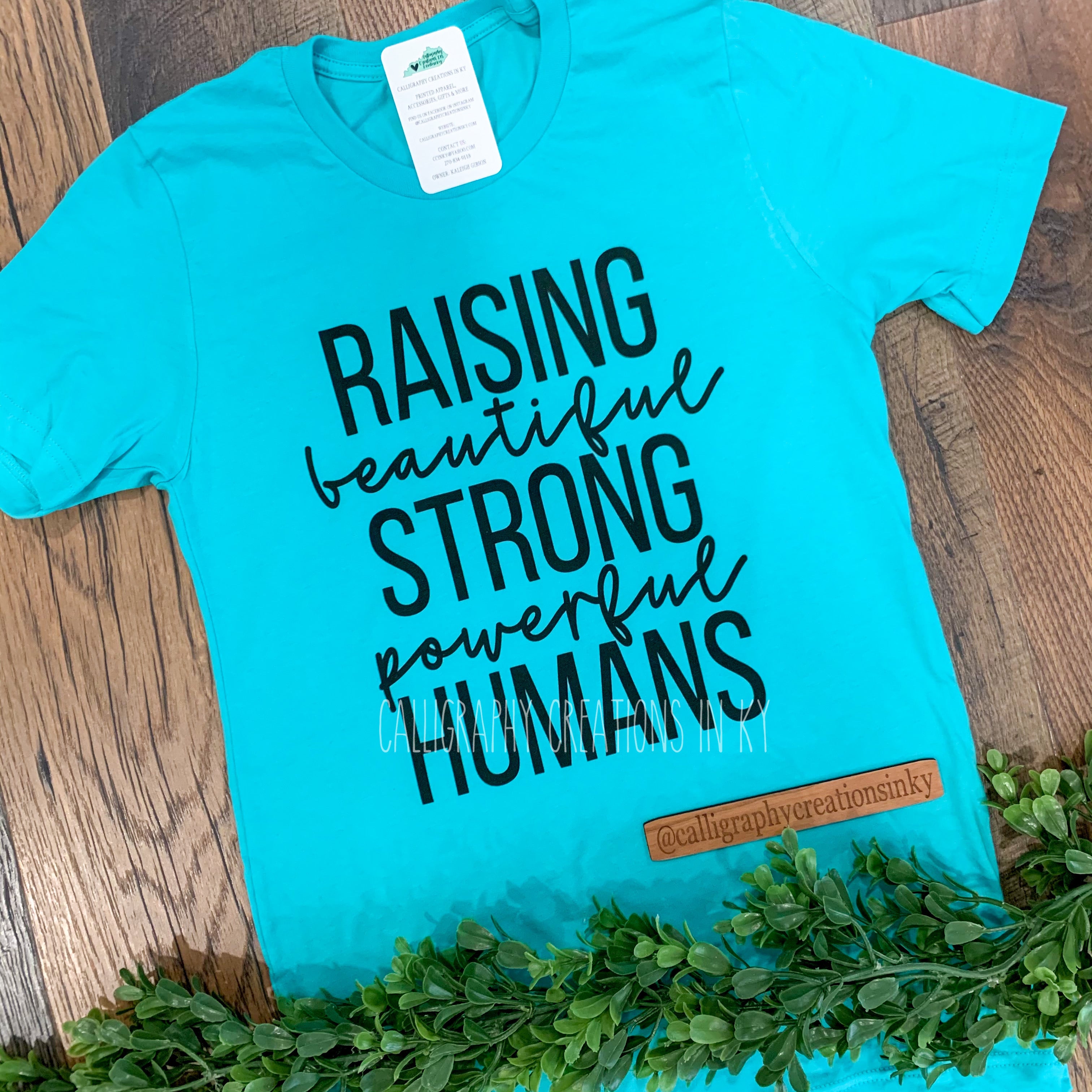 Raising Humans Tee Calligraphy Creations In KY