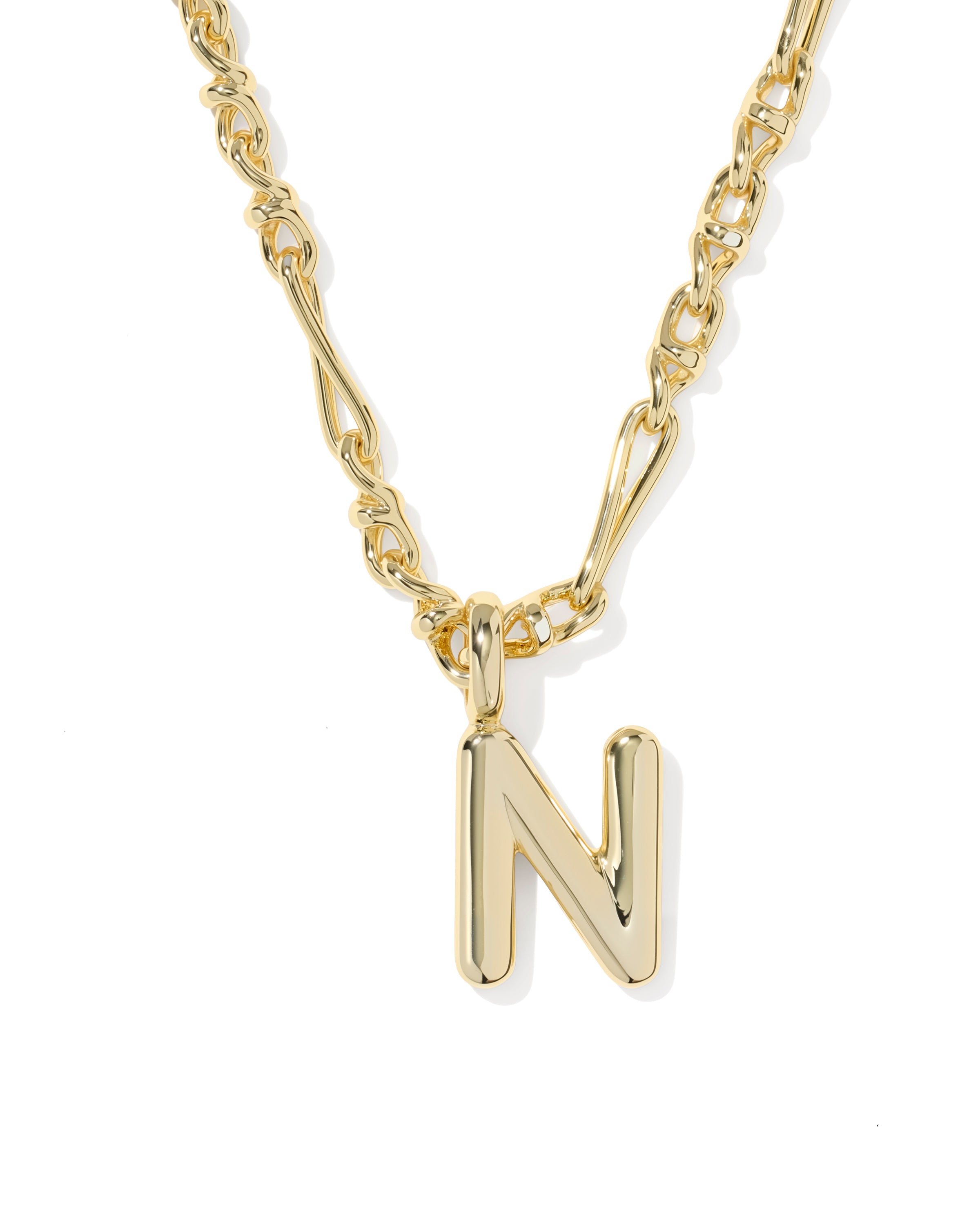 Gold necklace with a 'N' pendant on a white background