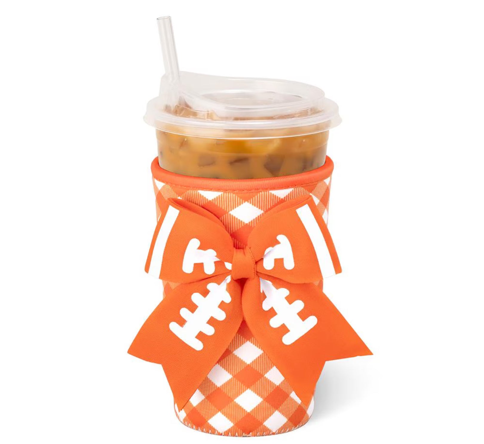 An orange and white buffalo check insulated cup sleeve with a large orange and white football-themed bow, holding an iced coffee in a clear plastic cup with a straw, on a white background.