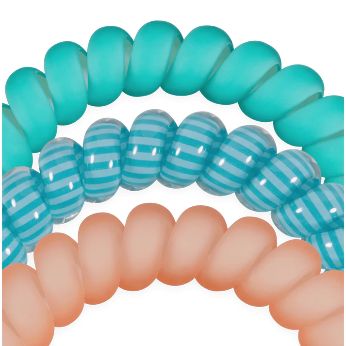 Three spiral hair ties in teal, blue with stripes, and peach on a white background