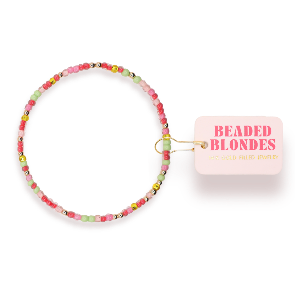 Beaded bracelet with a 'Beaded Blondes' branded tag on a white background