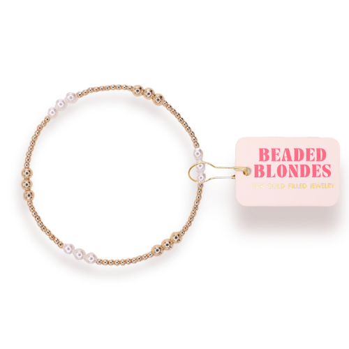 Beaded hair accessory with 'Beaded Blondes' packaging on a white background