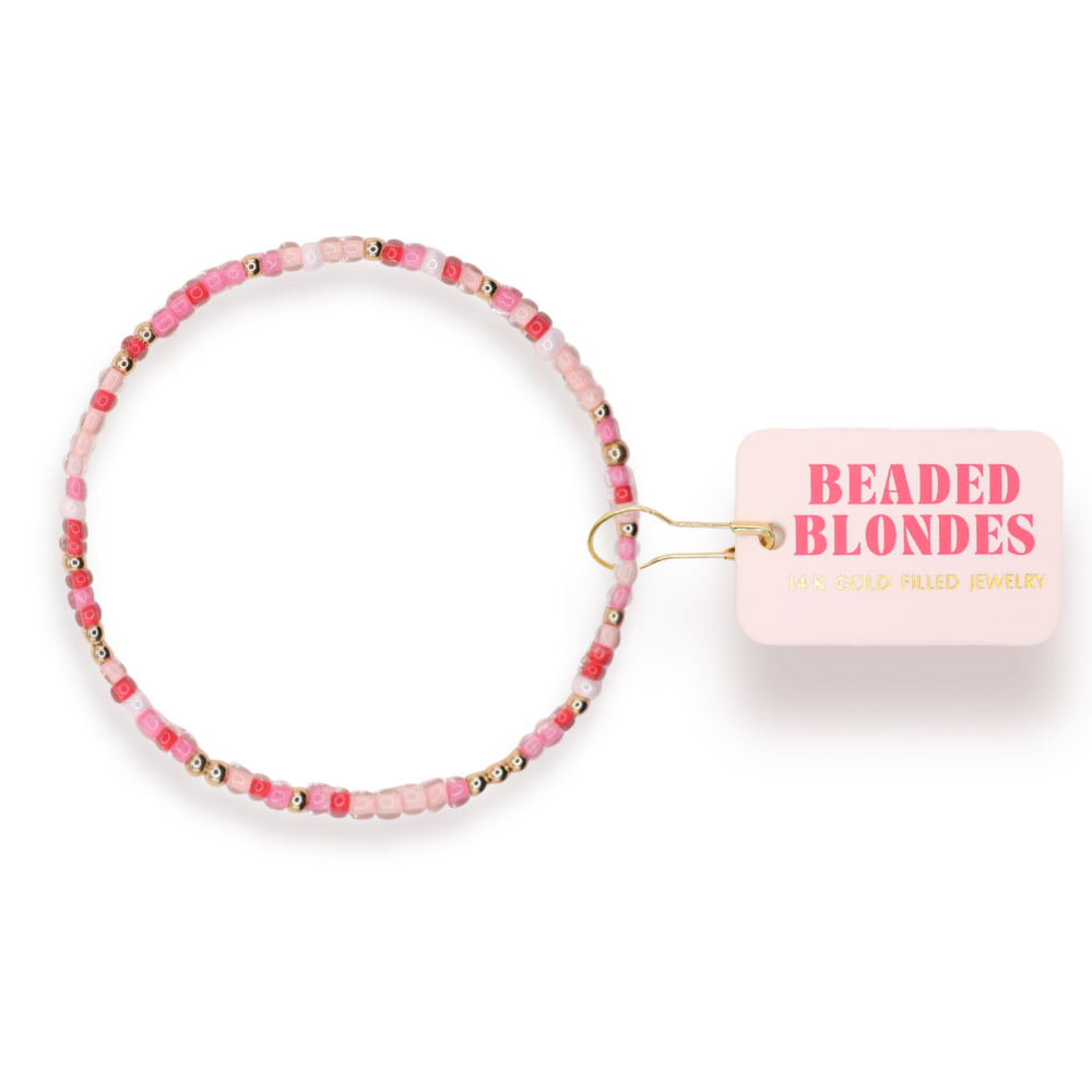 Beaded bracelet with a 'Beaded Blondes' branded tag on a white background