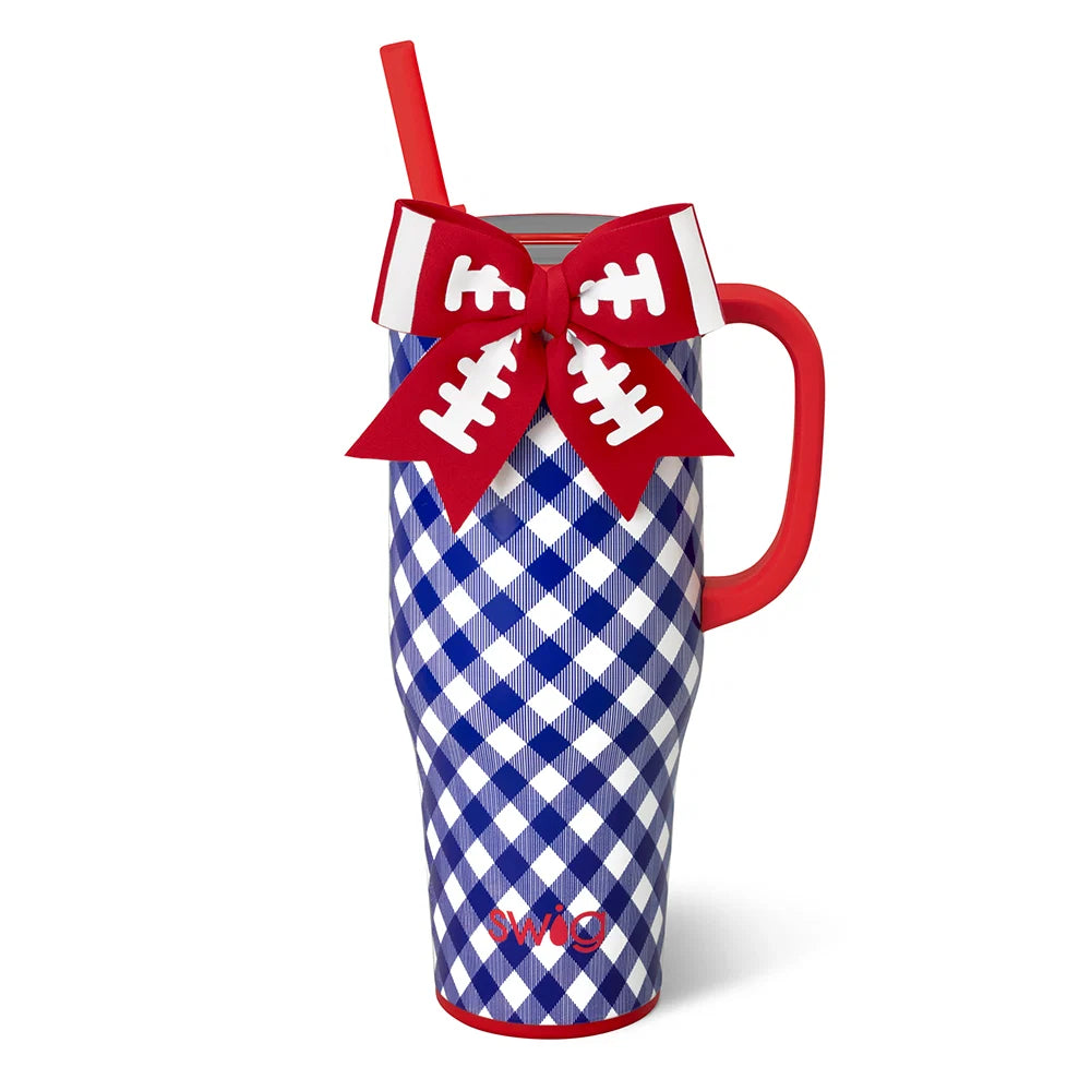 A red and white gingham patterned insulated tumbler with a red handle, red straw, and a red bow decorated with white football line details, shown on a white background.