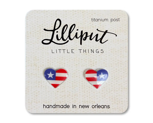 American flag heart shaped earrings on a beige card with white background 