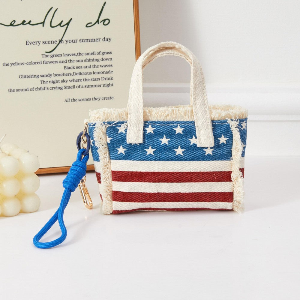 Miniature handbag with American flag printed. 