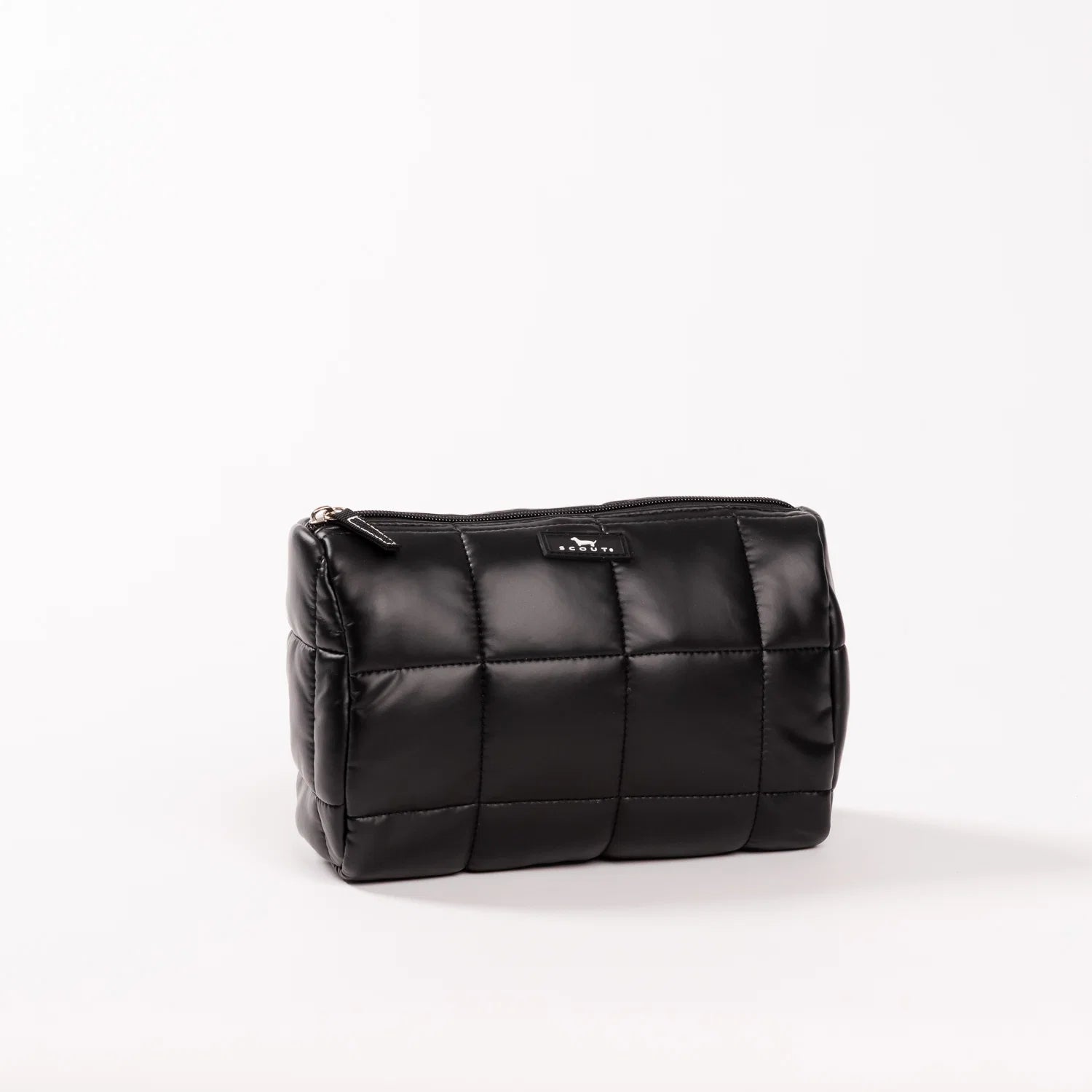 Black quilted cosmetic bag on a white background
