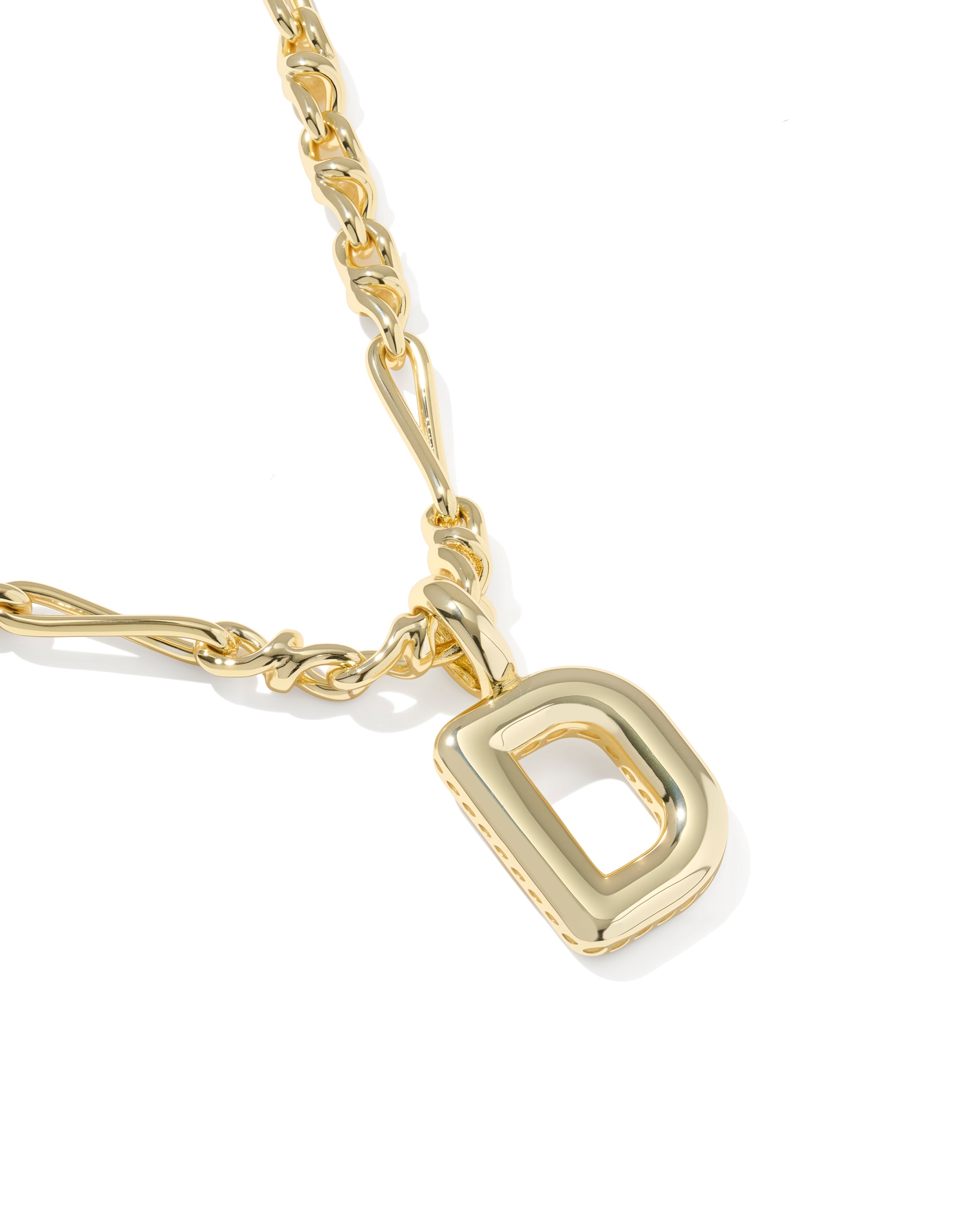 Gold necklace with a heart-shaped pendant on a white background