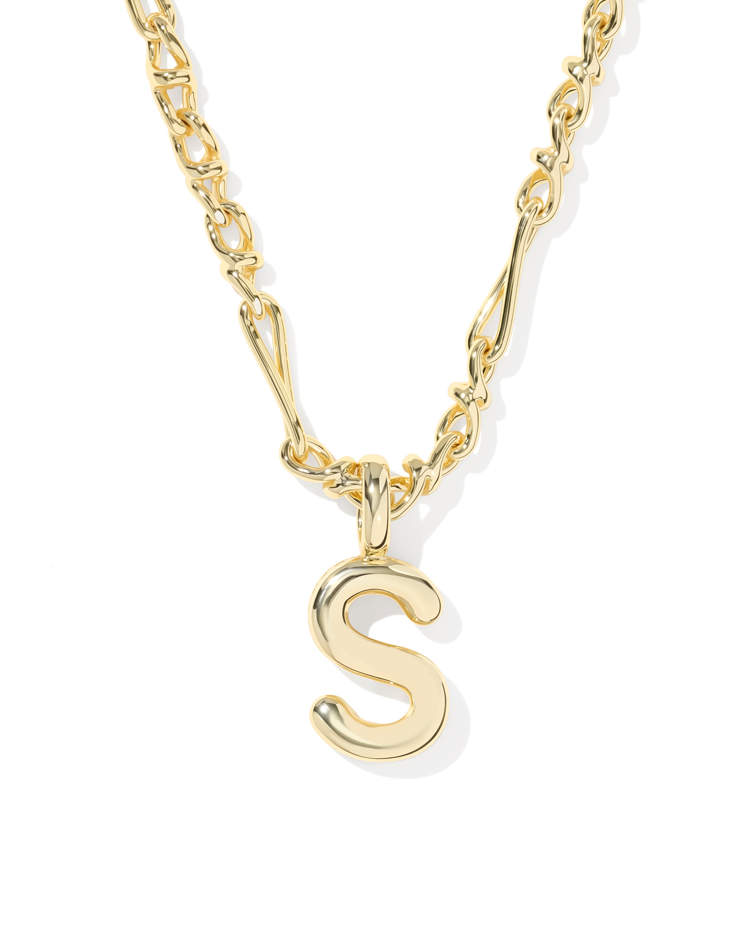 A gold initial necklace featuring a polished cursive letter 'S' pendant on a matching chain, shown against a plain white background.