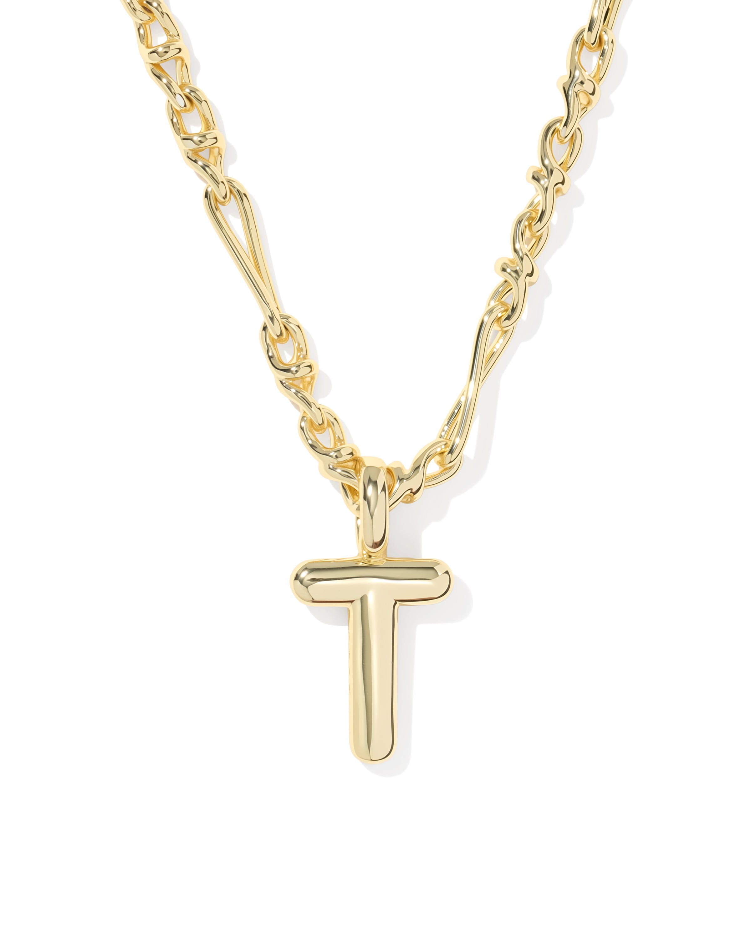 A gold initial necklace featuring a polished, lowercase-style letter 't' pendant on a matching chain, shown against a plain white background.