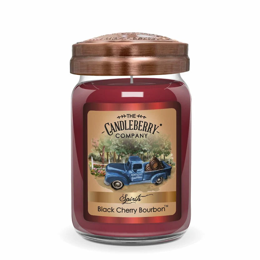 A jar candle with a red wax, a brown lid, and a label featuring an illustration of a blue vintage truck. The product is called Black Cherry Bourbon.