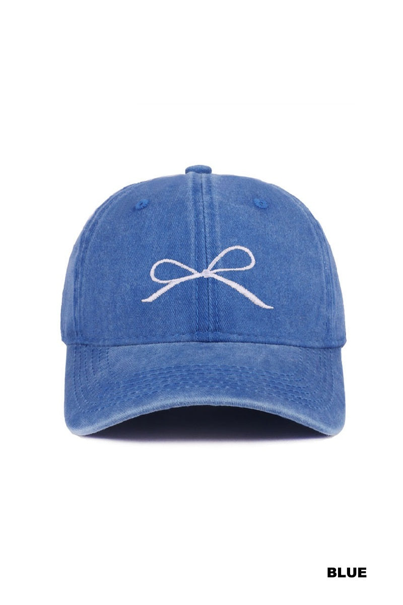 Blue cap with a white bow design on a white background