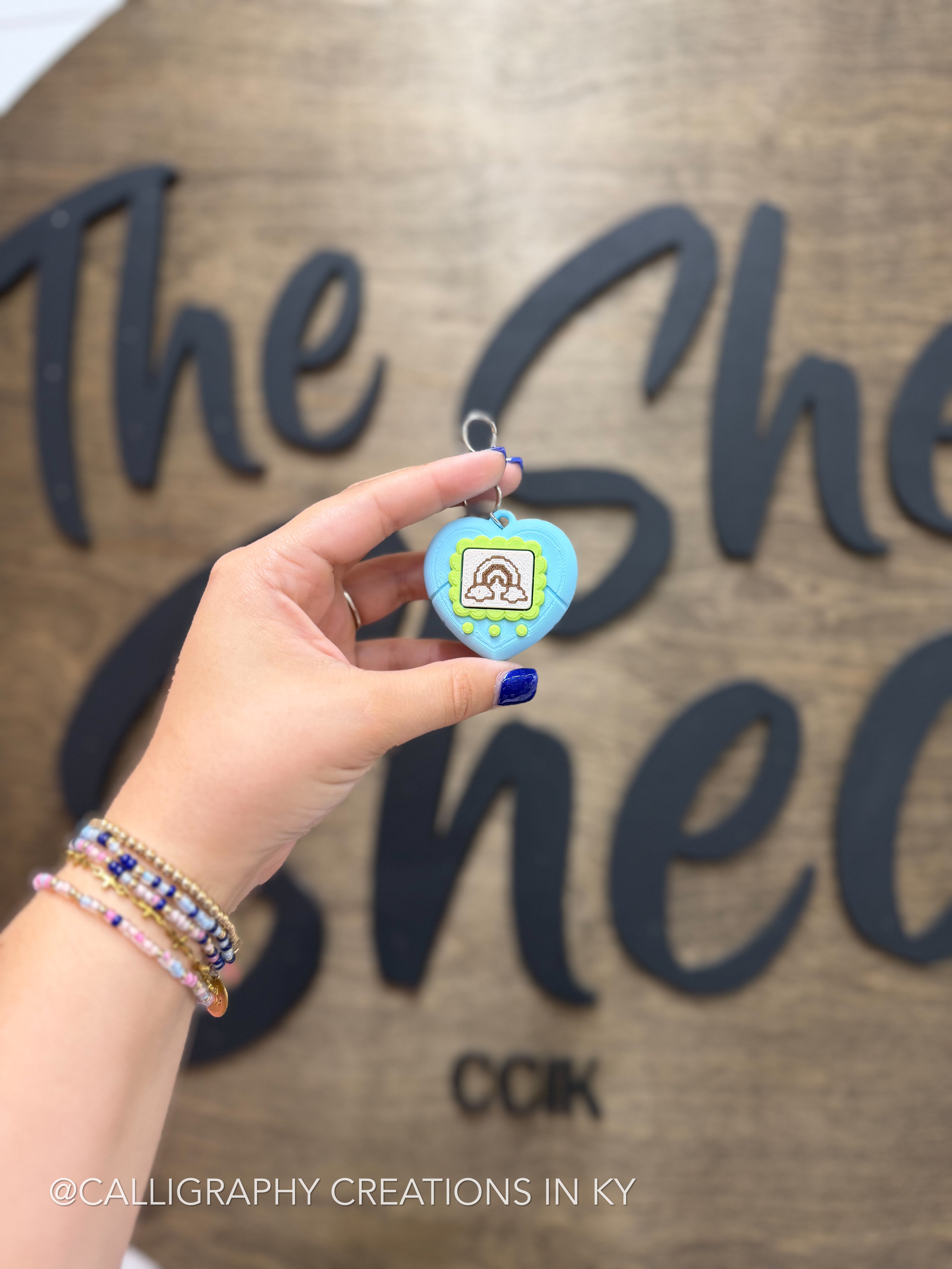 Blue and green fidget clicker keychain 