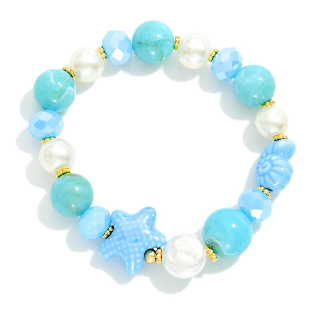 Beaded bracelet with blue and white beads on a white background