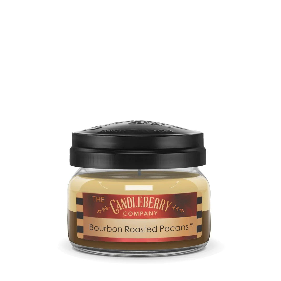 A small clear jar with a black lid labeled 'The Candleberry Company Bourbon Roasted Pecans'.