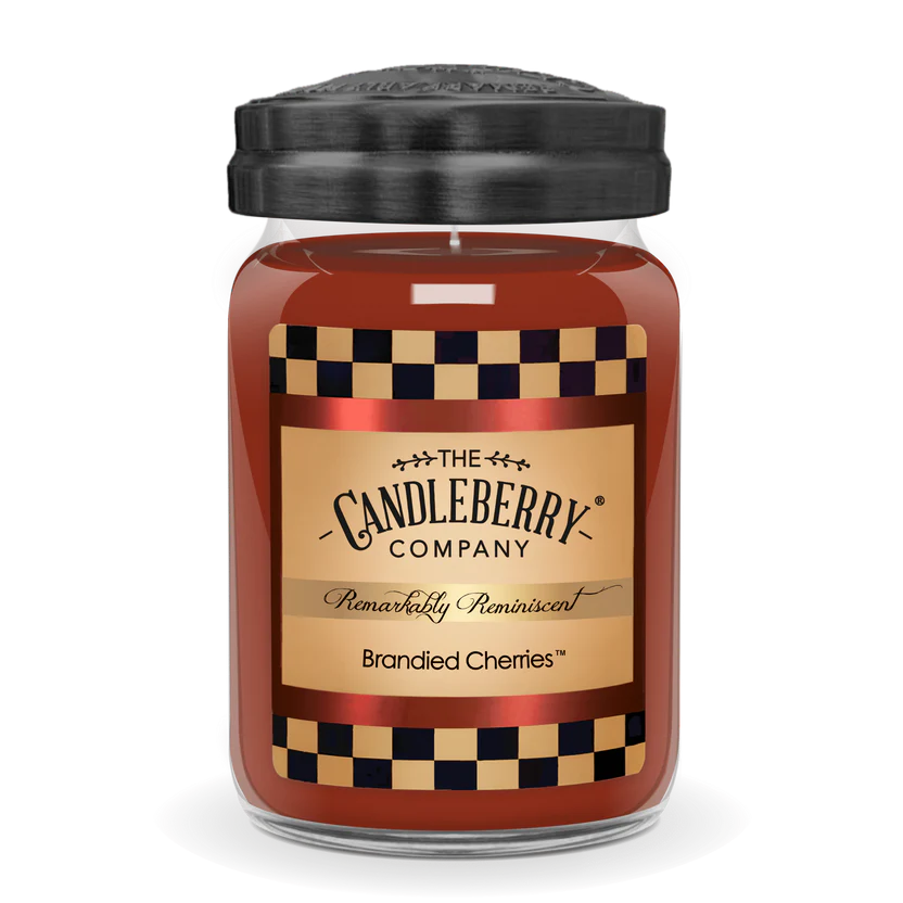 A jar candle with a label reading 'Brandied Cherries' by The Candleberry Company.