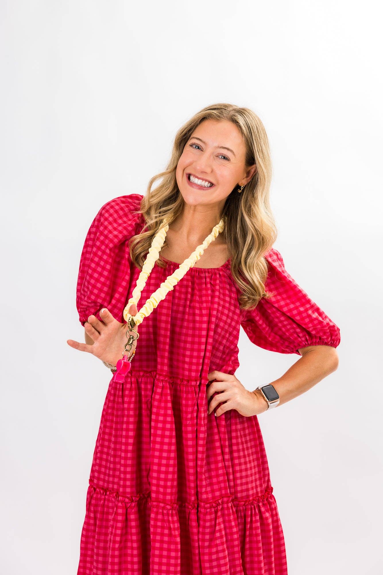 Woman wearing a red dress with a white background