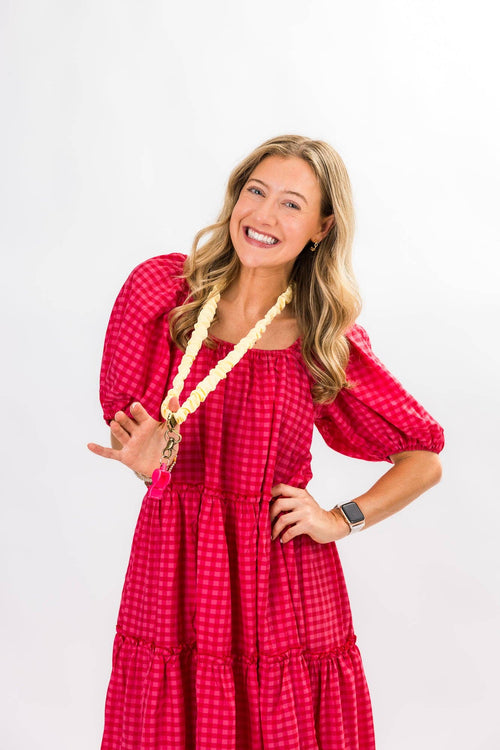 Woman wearing a red dress with a white background