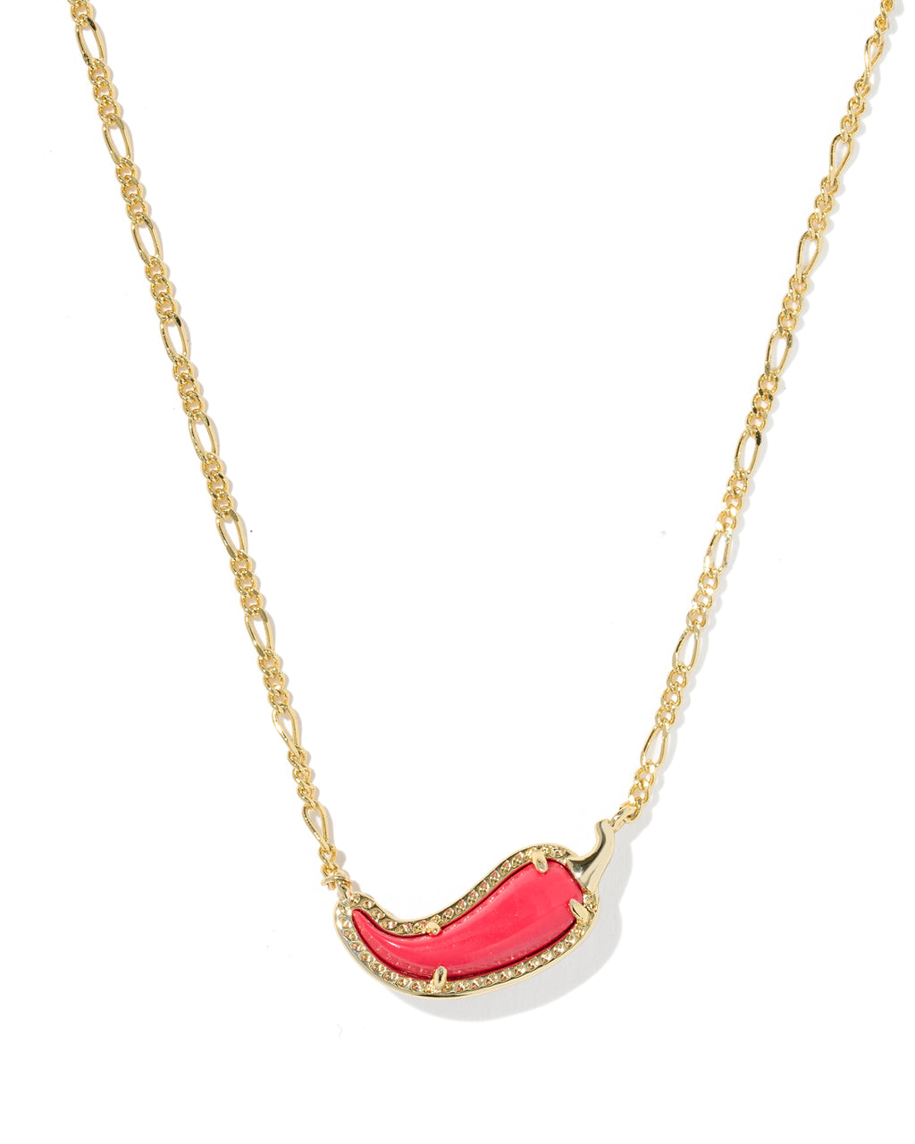 A gold Figaro chain necklace featuring a crescent-shaped pendant with a vibrant pink center and a border of small clear crystals, shown on a plain white background.