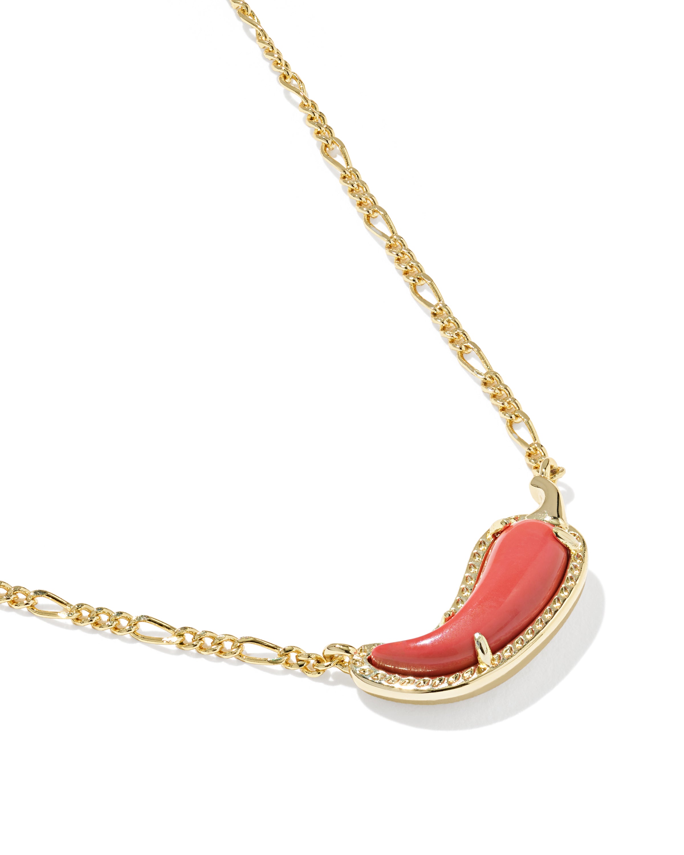 A gold chain necklace featuring a crescent-shaped coral pendant with a gold border and small clear stones, shown on a white background.