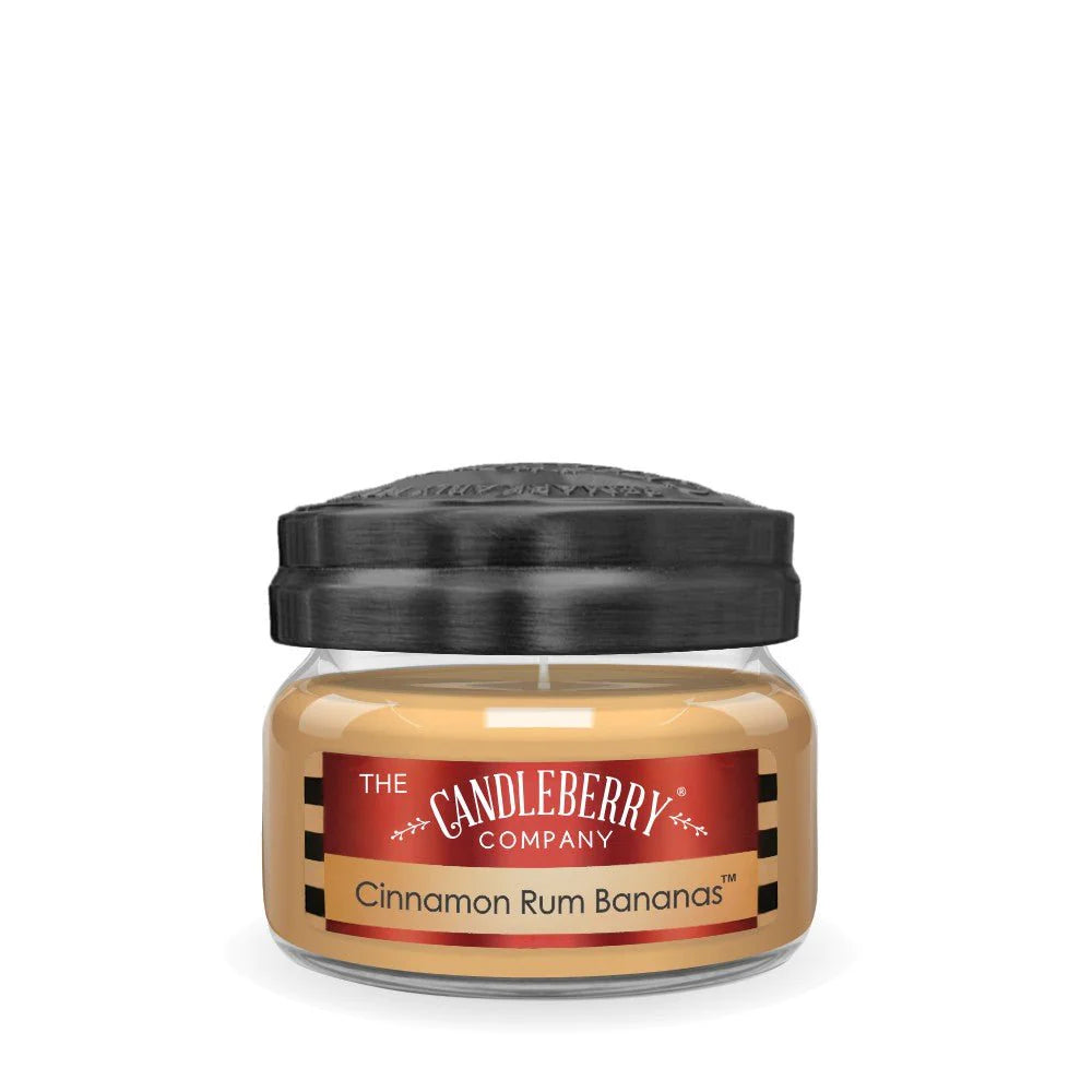 Small Candleberry branded candle with cinnamon rum bananas scent label