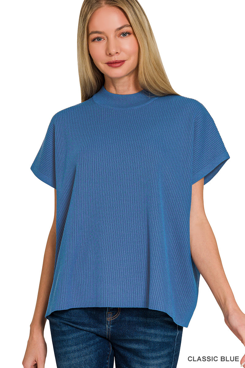 Woman wearing a blue textured top on a white background
