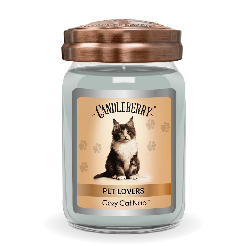 A jar candle with a lid, featuring an image of a cat on the label, and text that reads 'PET LOVERS Cozy Cat Nap™'. The candle is from the brand Candleberry.