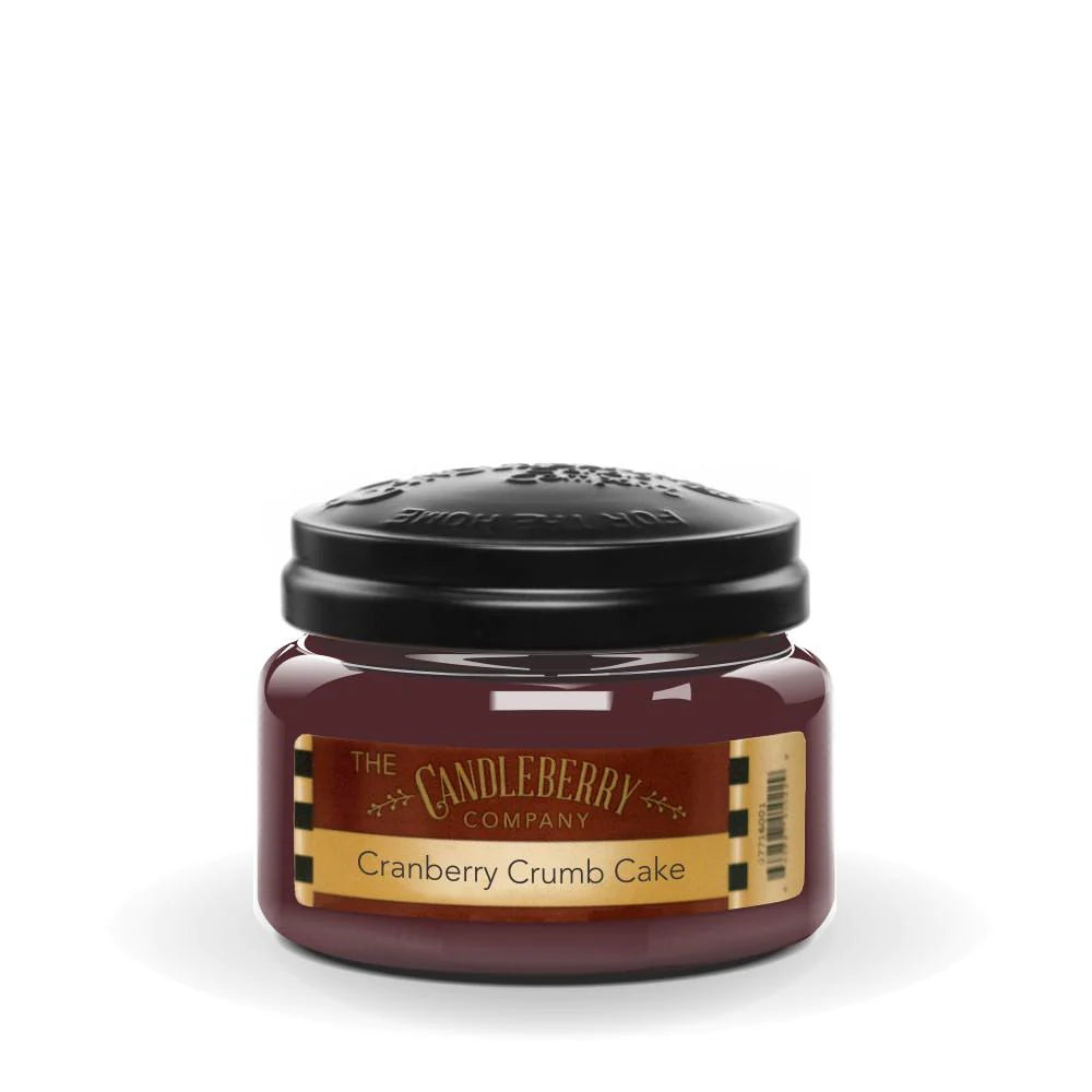A small jar candle with a black lid, labeled 'Cranberry Crumb Cake' from The Candleberry Company.