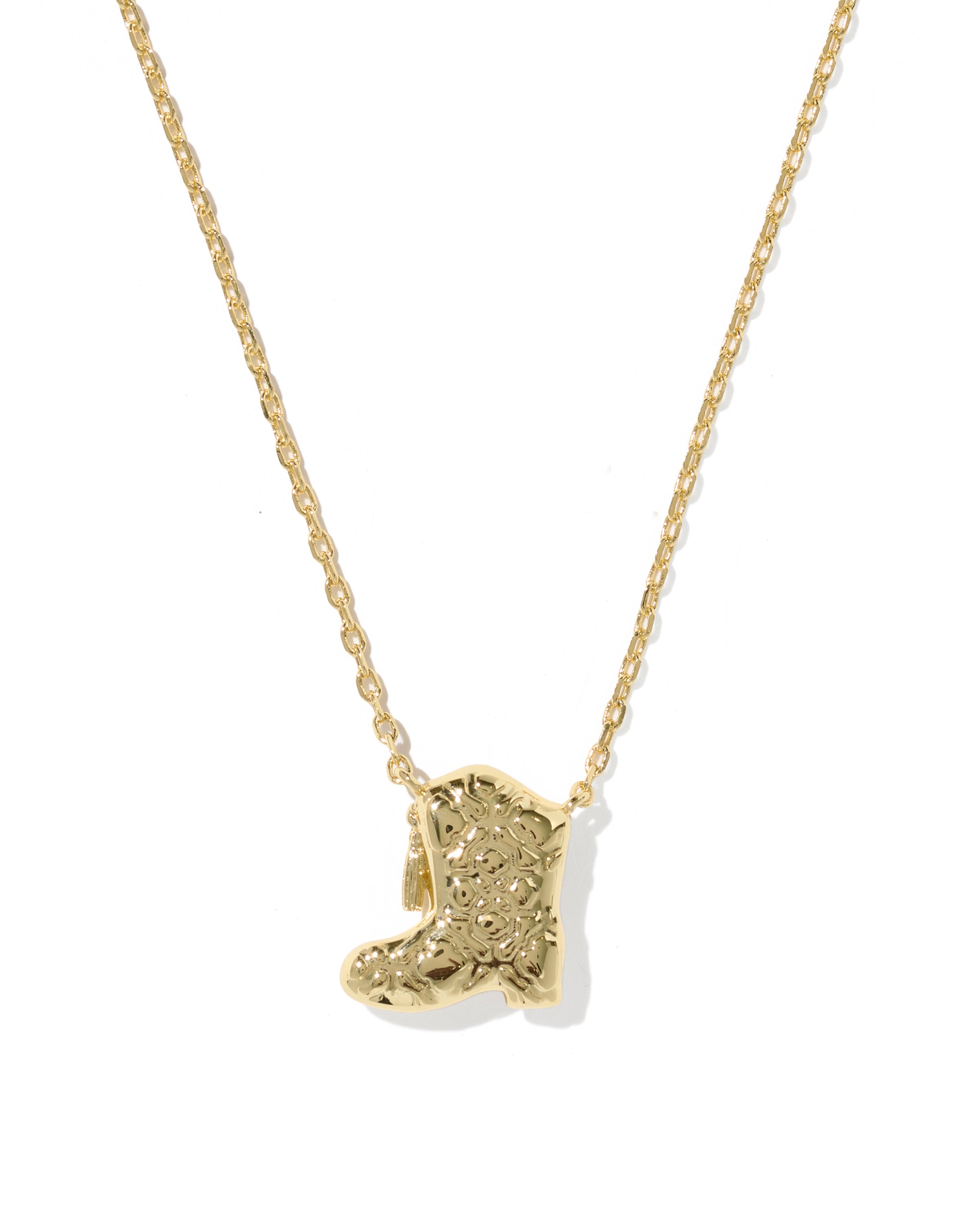A gold chain necklace featuring a textured, sculptural pendant shaped like a stylized animal head, shown against a plain white background.