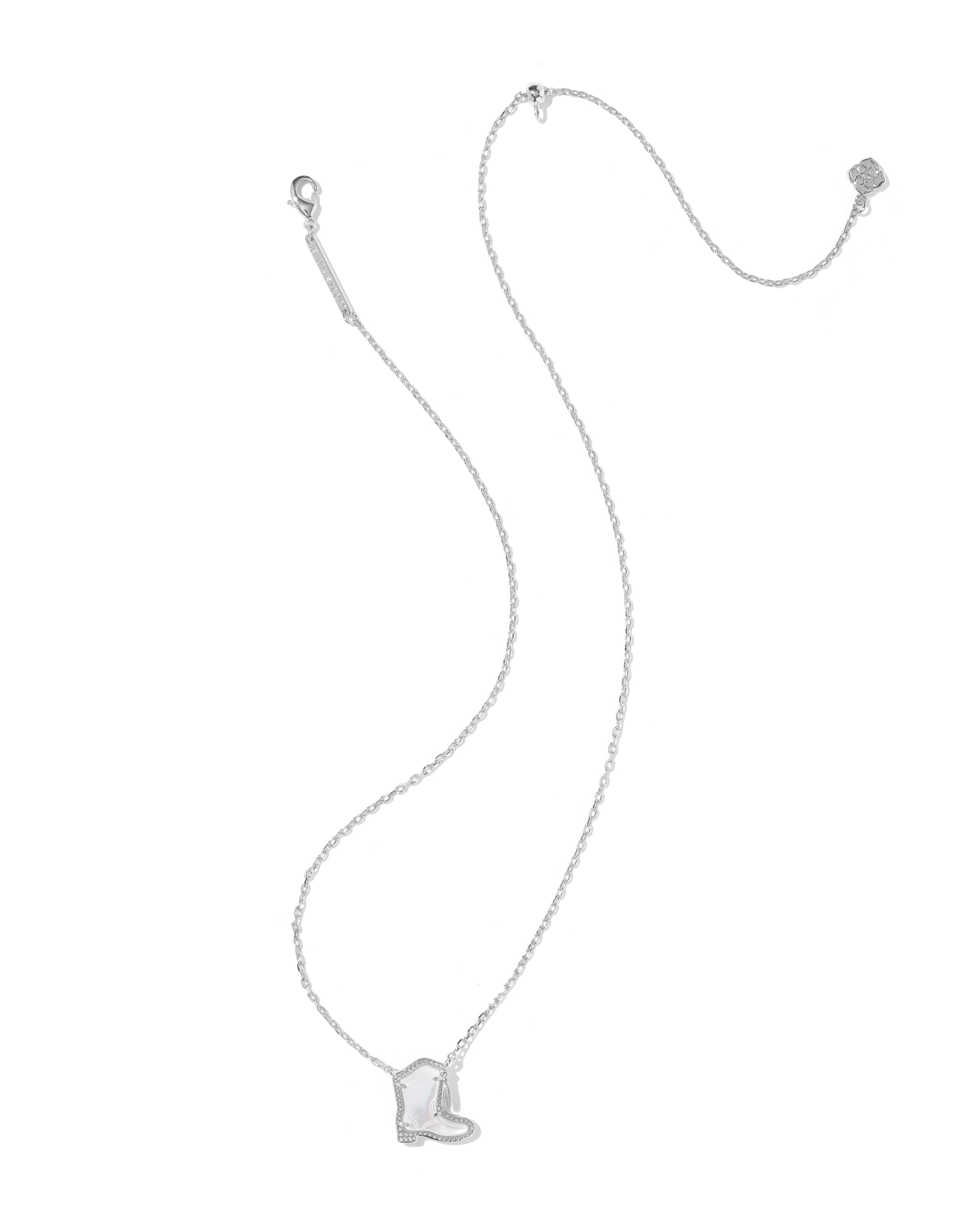A delicate silver chain necklace featuring a small boot-shaped pendant, displayed against a solid white background.