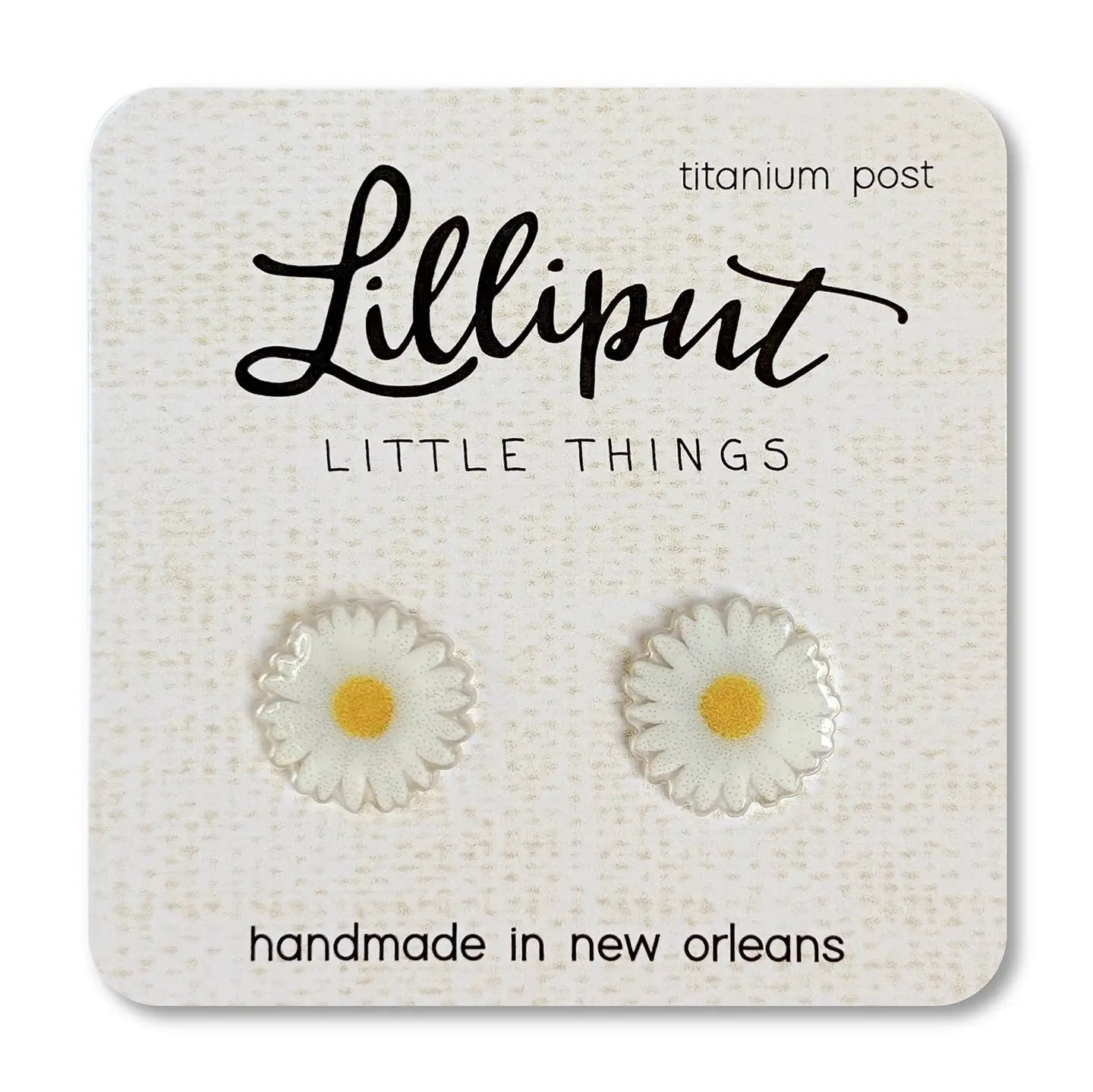 Daisy flower earrings on a Lilliput Little Things branded card.