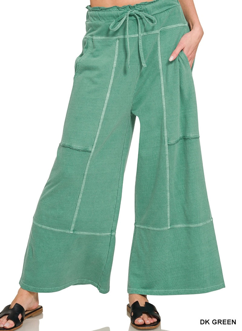 Dark green wide leg pants on a white background