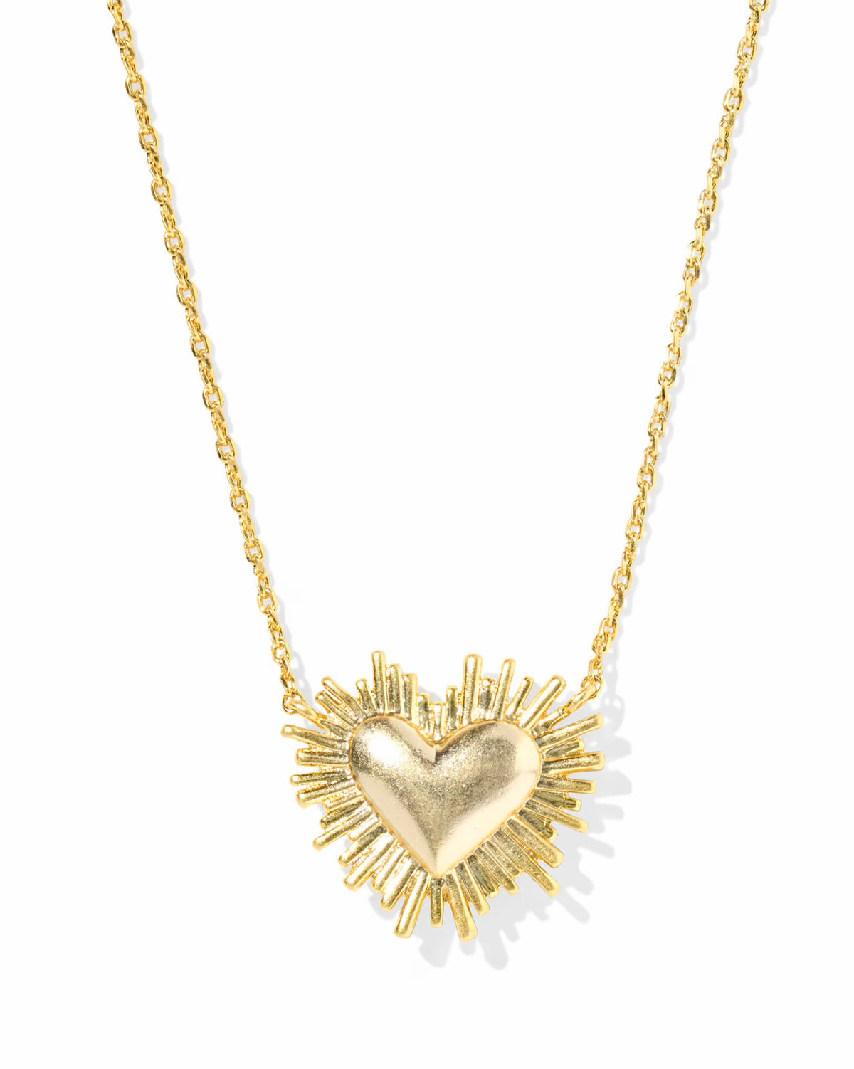 Gold heart-shaped necklace with a chain on a white background