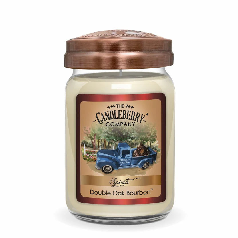 A white candle in a clear glass jar with a copper lid, labeled 'Double Oak Bourbon' by The Candleberry Company.