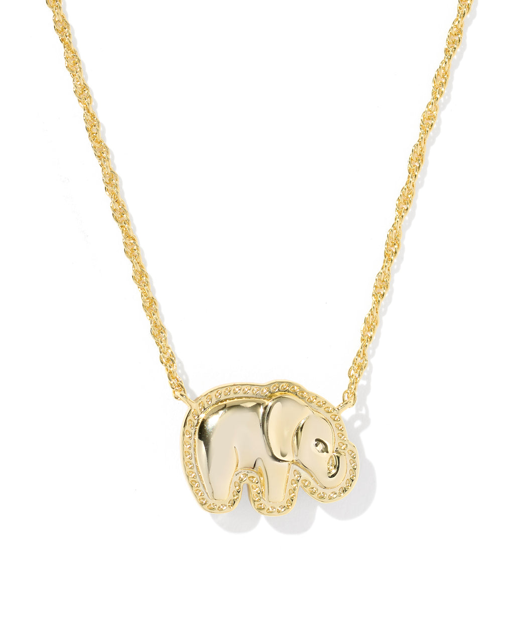 A gold necklace featuring a small elephant pendant with a textured, beaded border and a smooth, polished center, displayed on a clean white background.