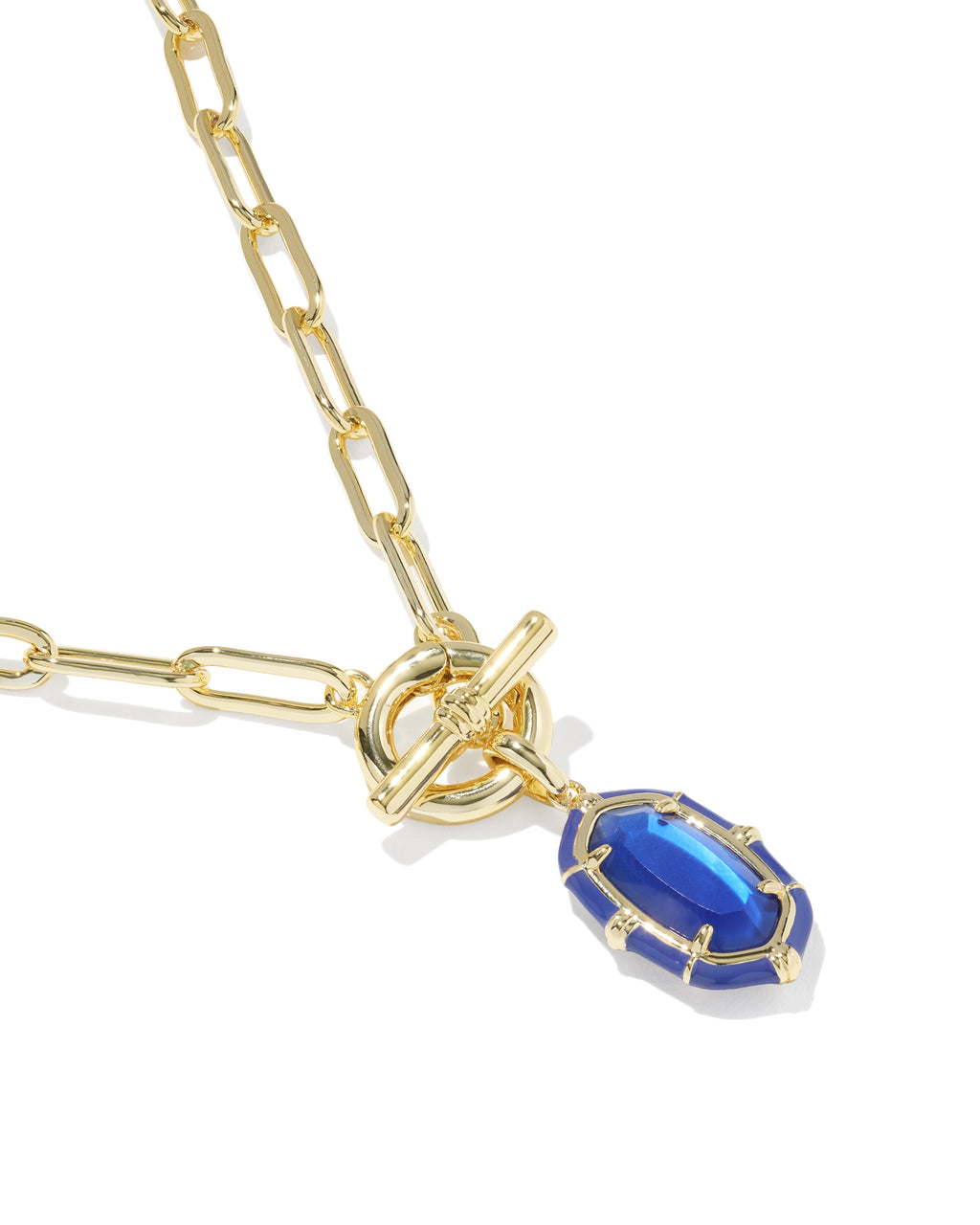 A gold paperclip chain necklace featuring a toggle clasp and a dangling marquise-shaped blue gemstone pendant, shown on a clean white background.