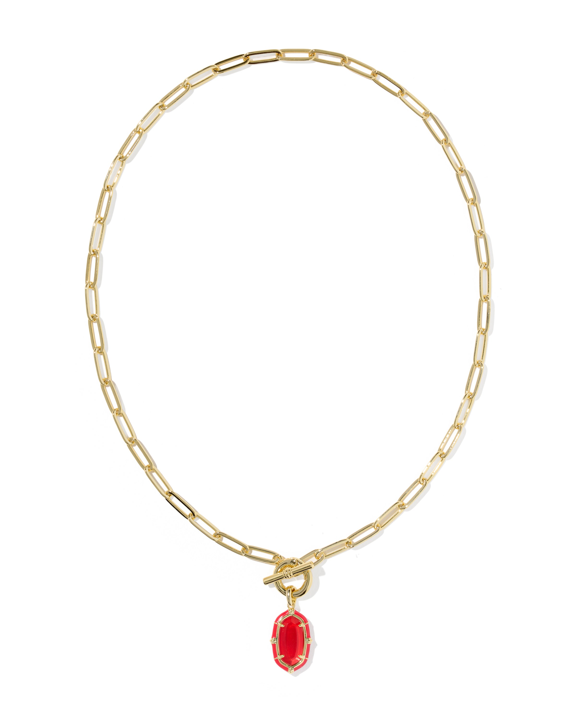 A gold paperclip chain necklace with a toggle clasp and a small red oval pendant, shown on a plain white background.