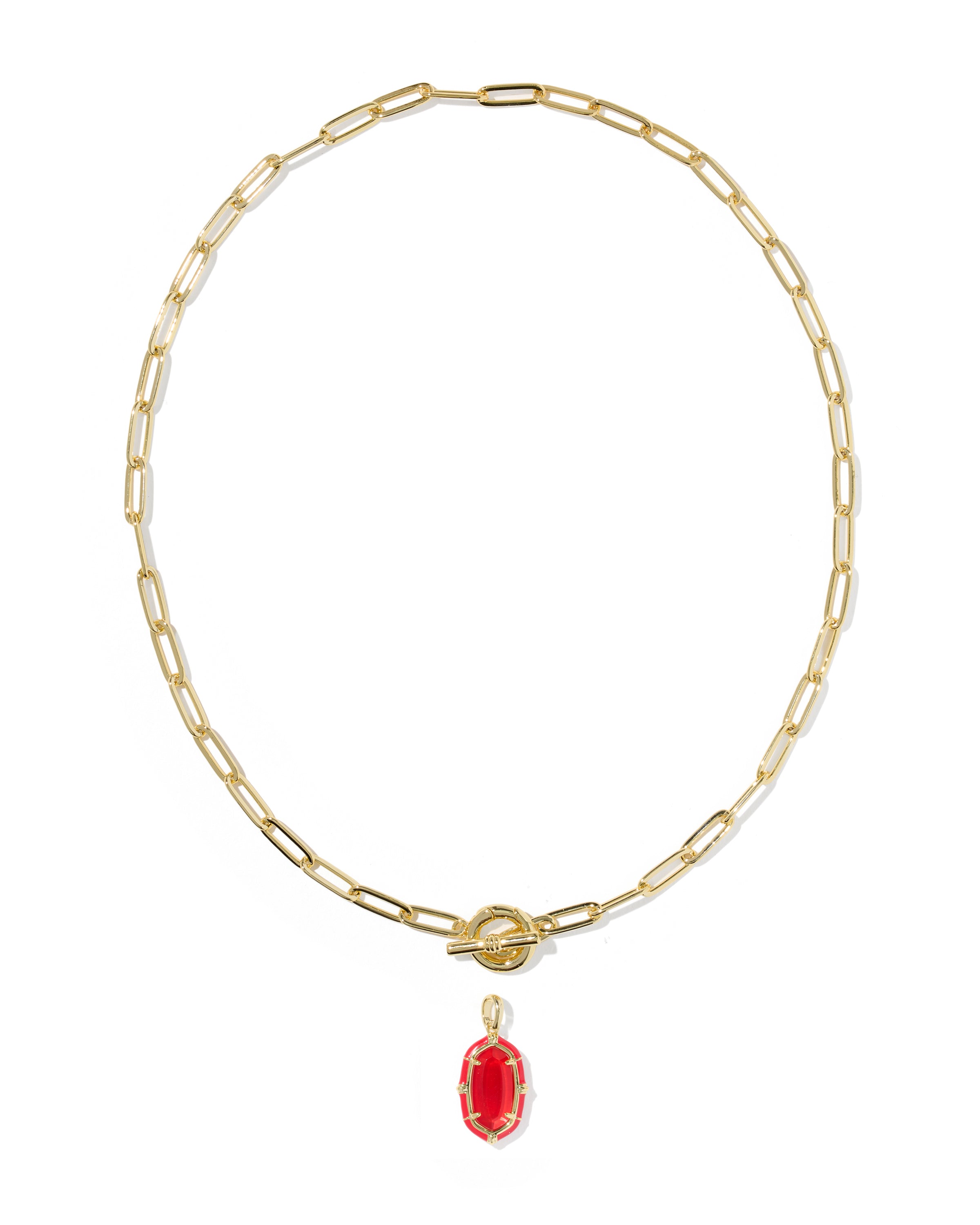 A gold paperclip chain necklace with a small oval red gemstone pendant, displayed on a clean white background.
