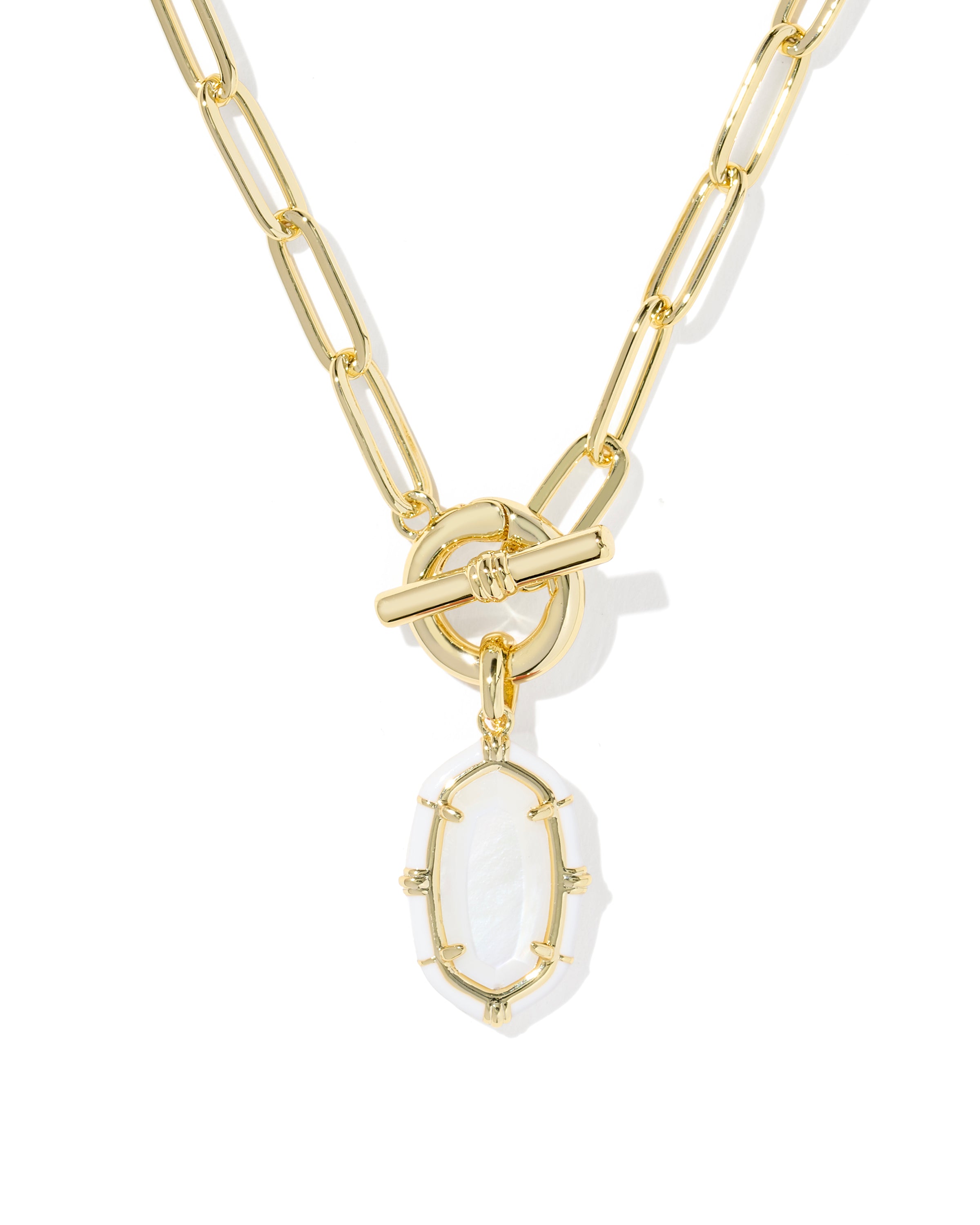 A gold paperclip chain necklace with a toggle clasp and a dangling oval white stone pendant, shown on a clean white background.