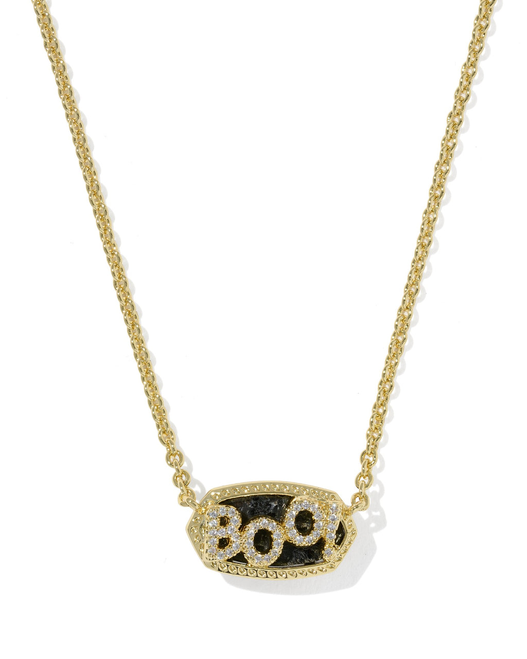 A gold chain necklace with an oval pendant featuring the word 'BOO' in sparkling clear stones over a textured black background, shown on a clean white background.