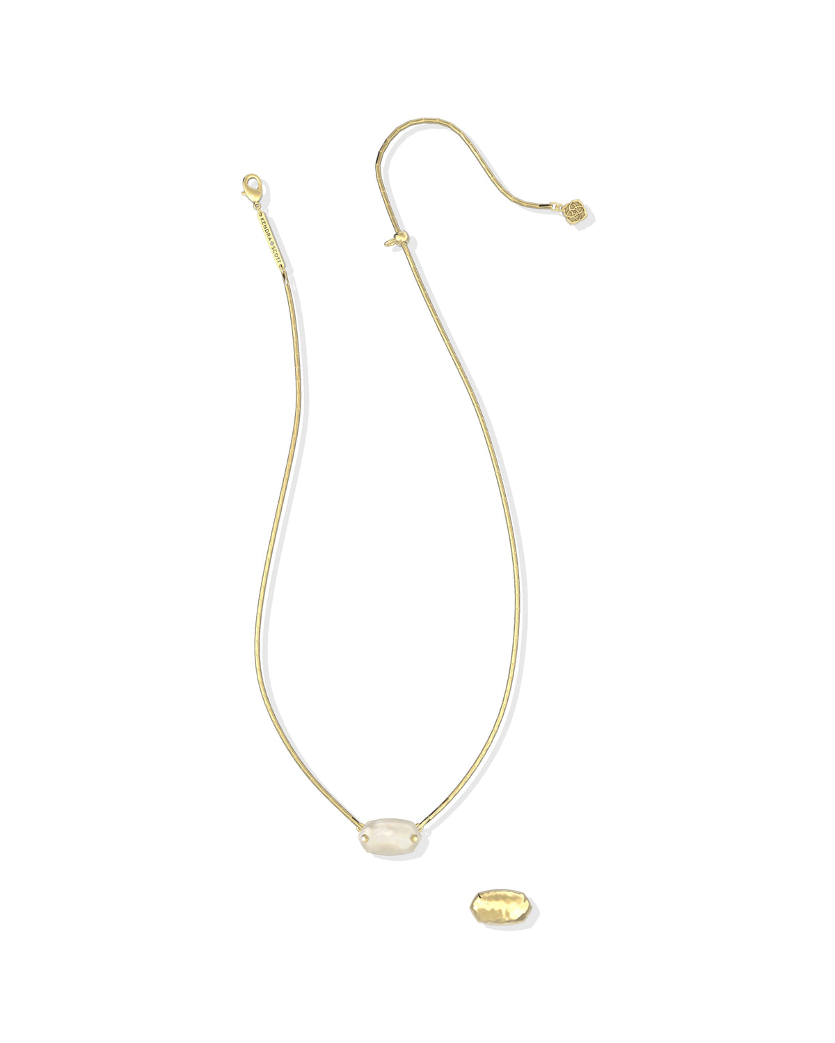 A delicate gold chain necklace featuring a small, polished white oval stone pendant and a separate matching gold bead charm, displayed on a clean white background.