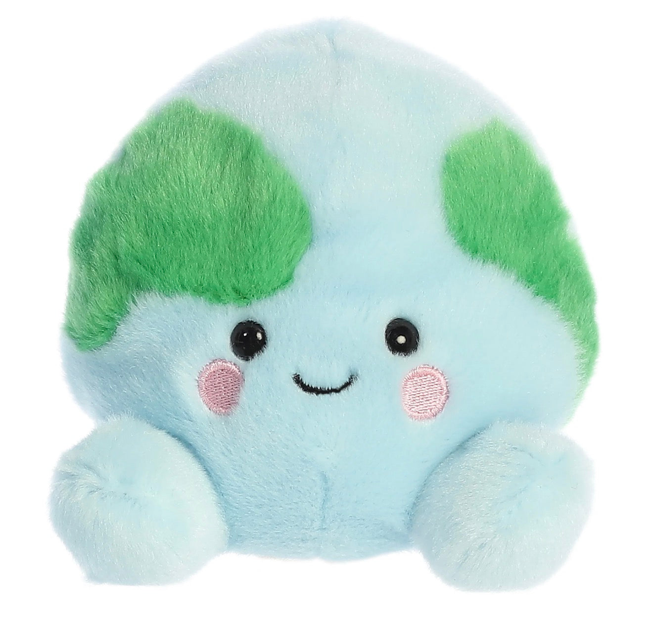 A cute, round, light blue plush toy with green leaf-like ears, embroidered black eyes and a smile, and pink cheek details, isolated on a white background.