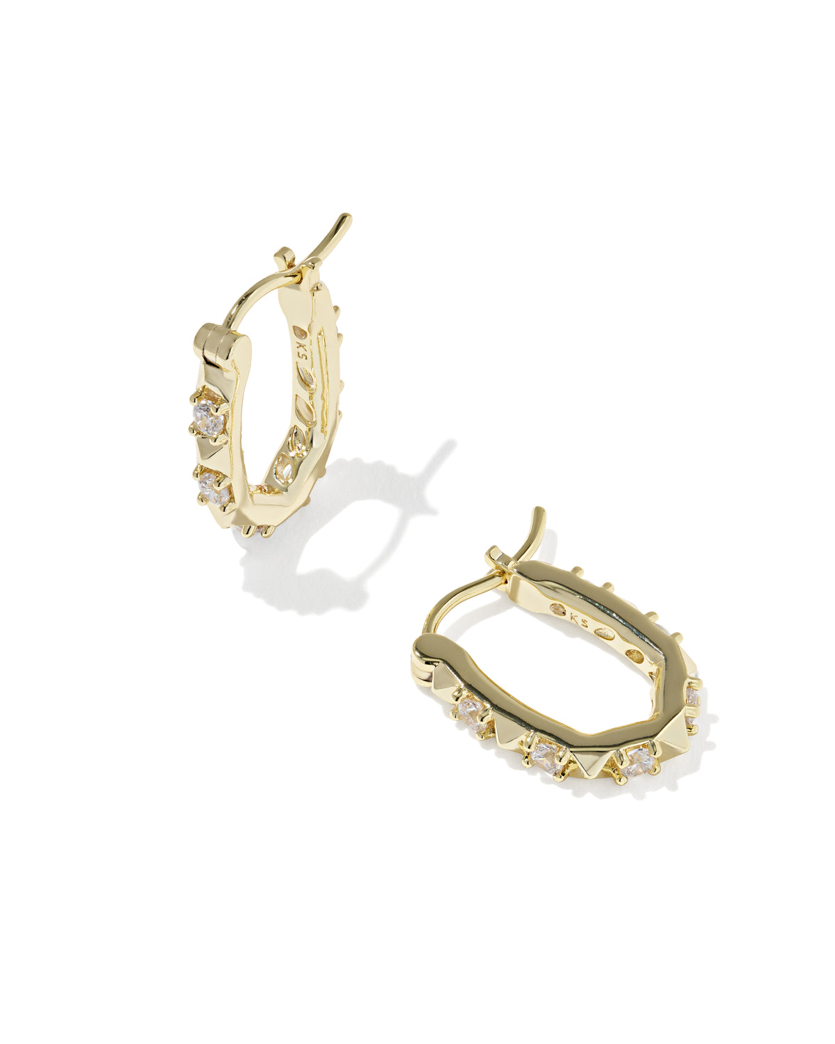 A pair of gold hoop earrings with small clear stones set along the front, displayed on a clean white background.