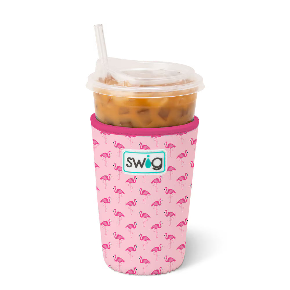 Pink swig cup sleeve with flamingo pattern and straw on a white background