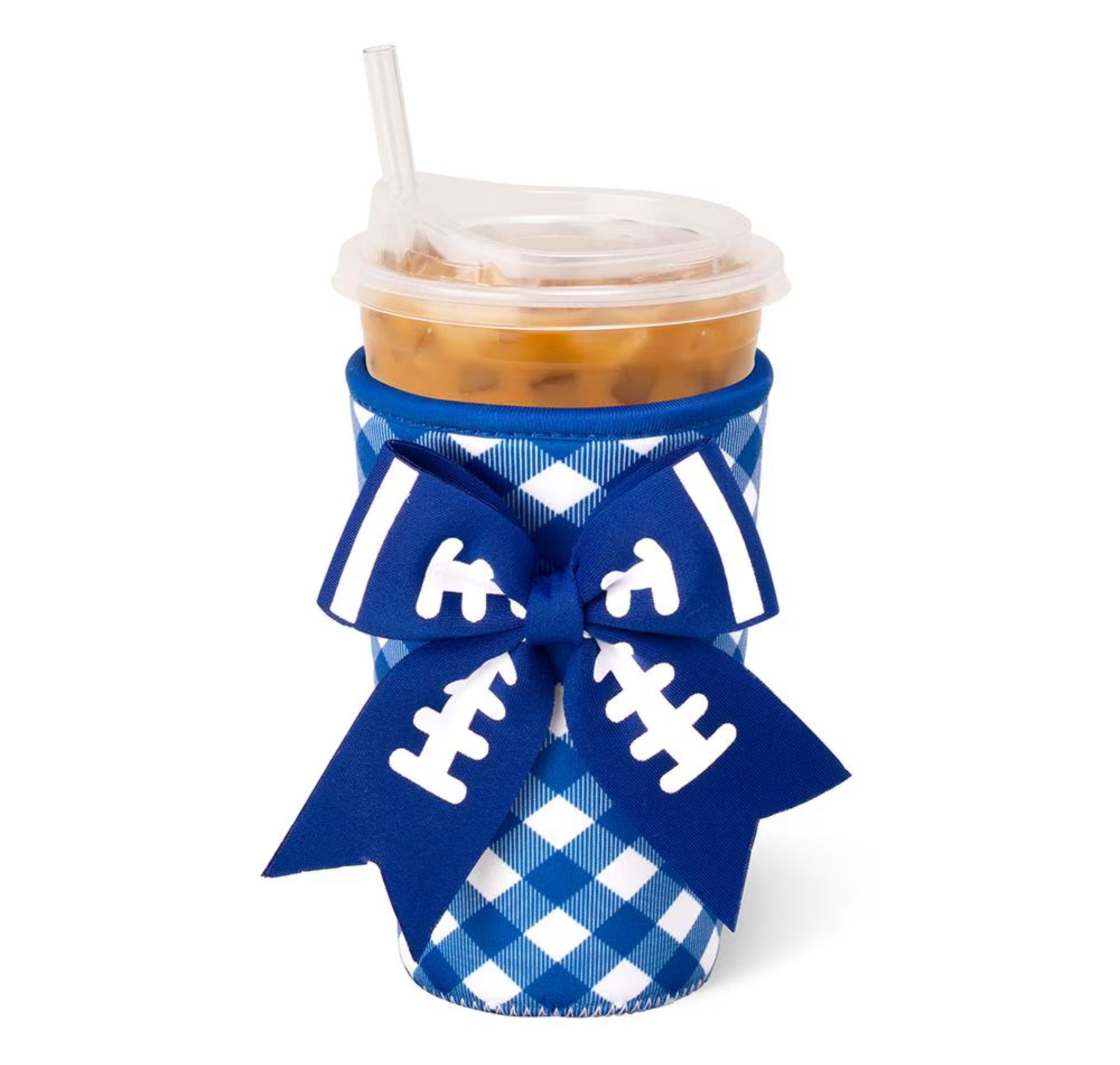 A blue and white gingham football-themed cup sleeve with a large blue bow printed with white football laces, holding an iced coffee in a clear plastic cup with a straw, on a white background.