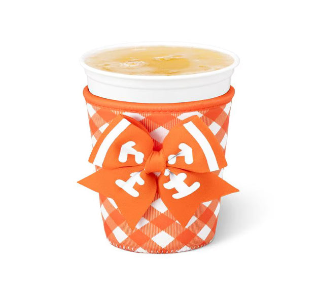 An orange and white checkered paper cup sleeve with a matching orange ribbon bow featuring white anchor details, shown on a white background.