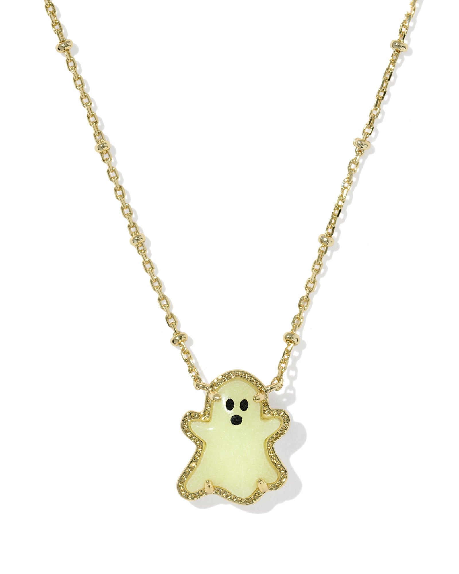 Neon ghost pendant necklace on a gold chain against a white background