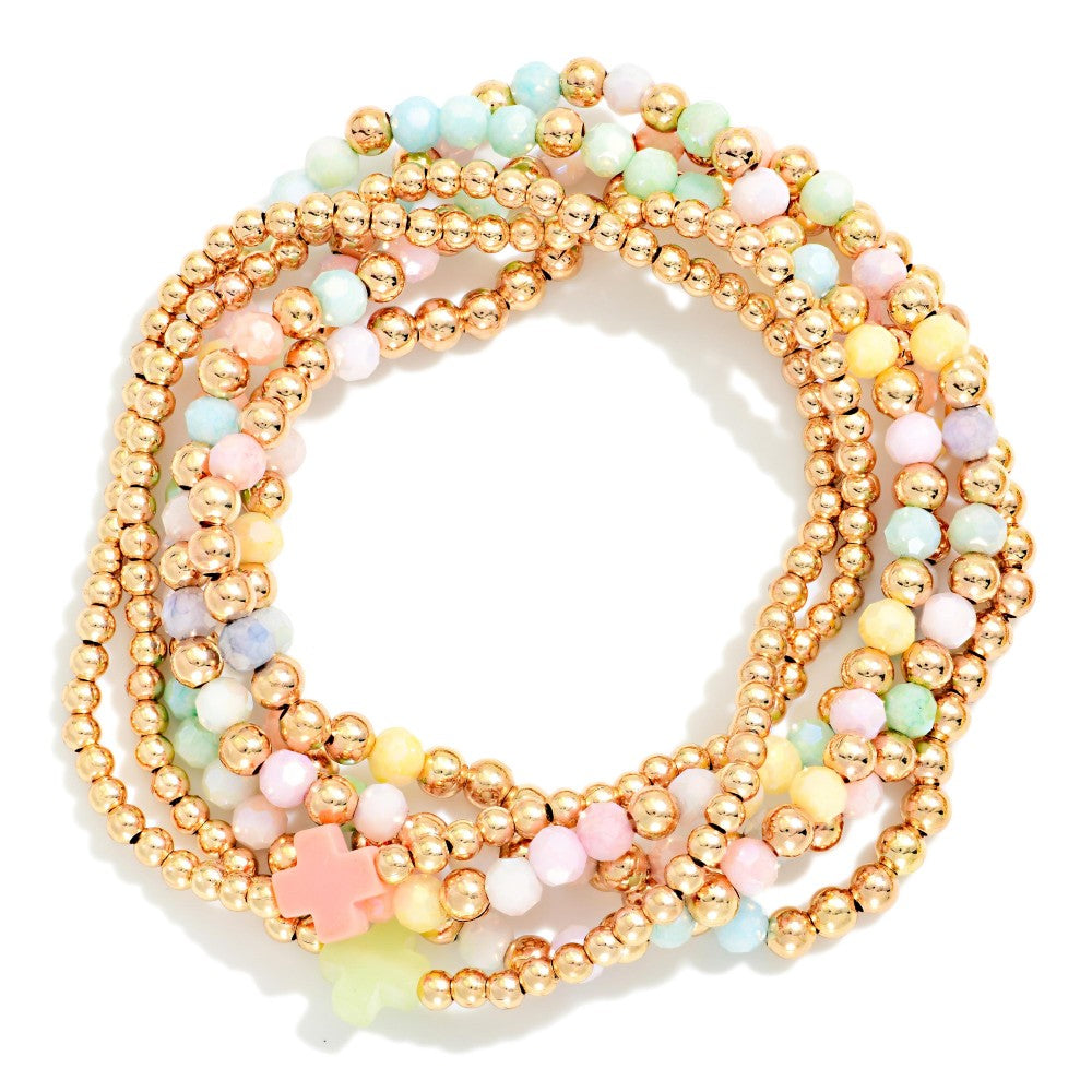 Rainbow and gold beaded bracelet set on a white background 