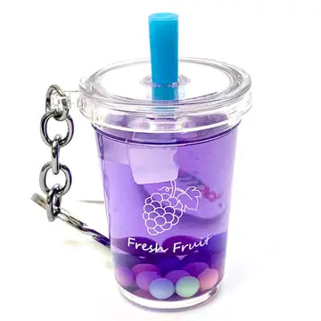 Purple tumbler keychain with a blue straw on a white background
