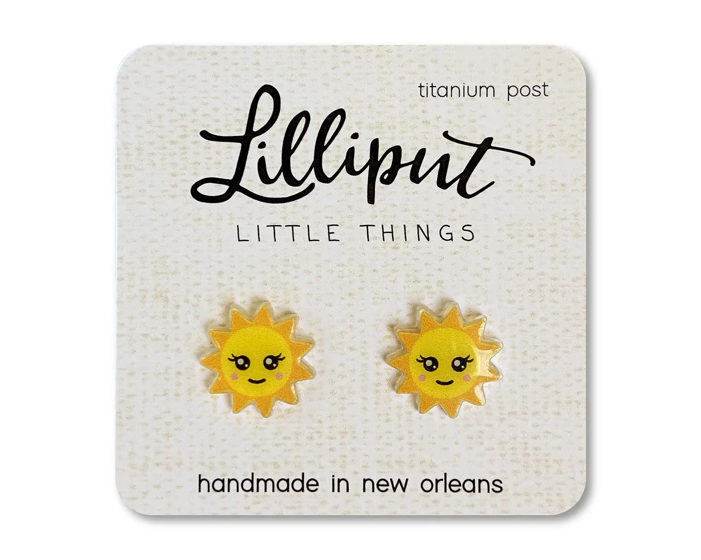 Sun-shaped earrings on a Lilliput Little Things branded card.